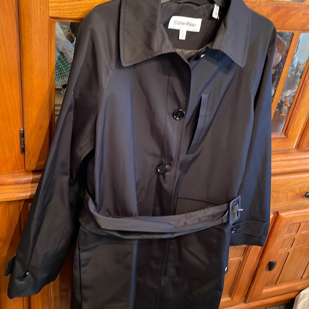 Calvin Klein ladies coat, size large, 3 pockets knee length new without tags